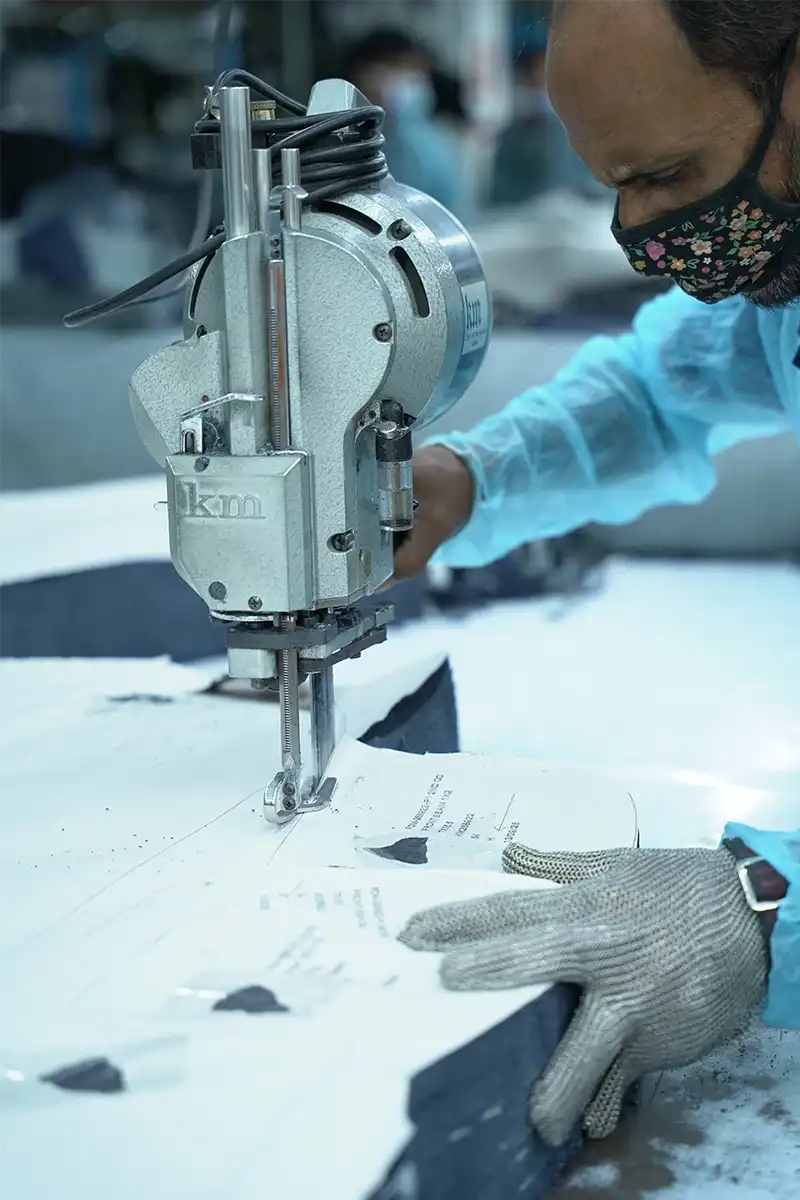 Man working on a sewing machine