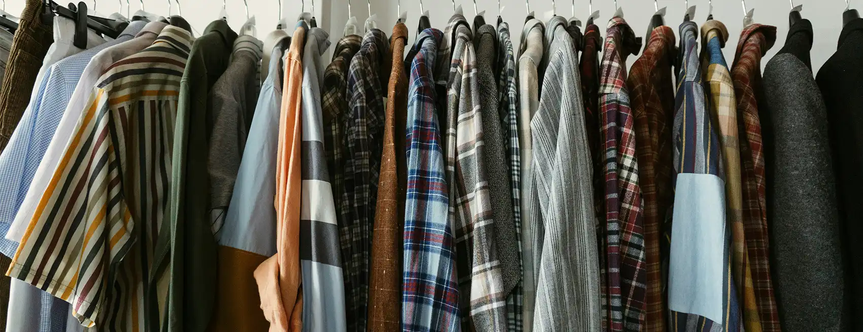 Different types of clothing on a rack